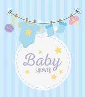 baby shower, hanging socks bodysuit pacifier and rattle round label background vector