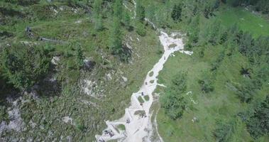 Aerial drone view of a group of people hiking in the mountains. video
