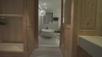 A woman enjoys a bubble bath in a bathtub at a luxury resort. video
