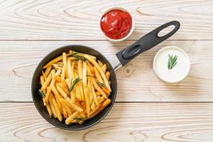 French fries with sour cream and ketchup photo