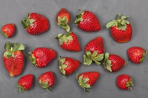 Fresh ripe strawberries on black background. photo