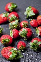 Fresh ripe strawberry with water drops closeup. photo