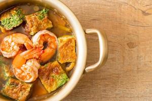 Sour soup made of Tamarind Paste with Shrimps and Vegetable Omelet photo