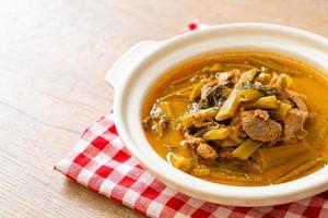 Thai pork curry with morning glory photo