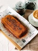 Delicious chocolate pudding with coffee on a tray photo