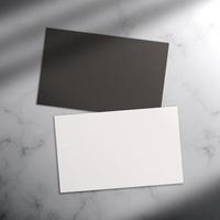 Minimalist business card mockup isolated on marble floor background with shadow light.
