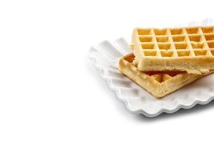 Belgium waffers on white ceramic plate isolated on white background. photo