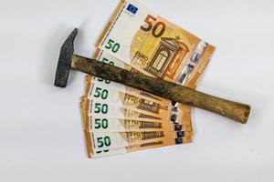 of 50 euro banknotes with work tool photo