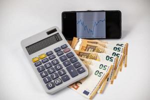 euro banknotes with calculator and graph photo