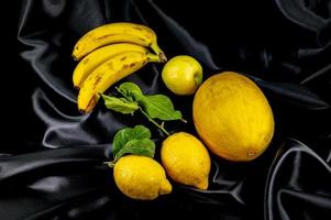 yellow fruit on a black background photo