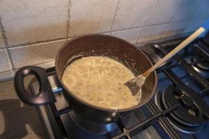 risotto with truffle boiling in a pot photo