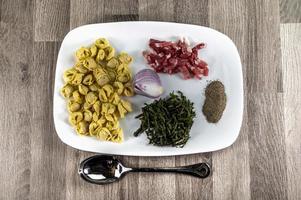 ingradients for cappelletti, bacon and asparagus photo