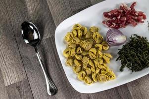 ingradients for cappelletti, bacon and asparagus photo