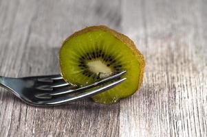 composition with kiwi and forks photo
