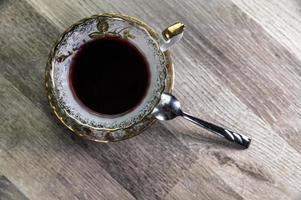 crafted cup of tea viewed from above photo