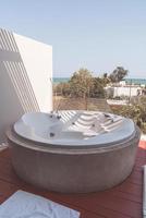 Jacuzzi bath tub on balcony photo