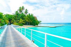 Beautiful tropical Maldives resort hotel and island with beach and sea photo