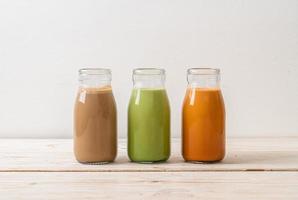 Thai milk tea, matcha green tea latte and coffee in bottle photo