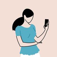 young woman standing holding a smartphone in his hand vector