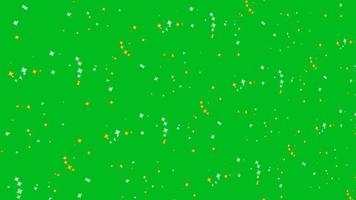 Desenfoque de pequeñas estrellas plateadas y doradas que vuelan partículas brillantes de movimiento abstracto se desvanecieron lentamente sobre fondo de pantalla verde video