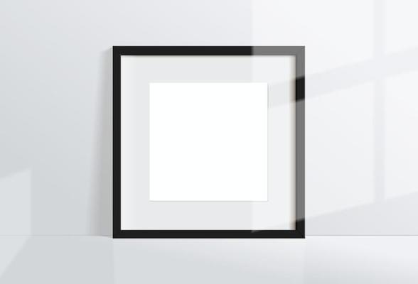 Minimal empty square black frame picture mock up hanging on white wall background