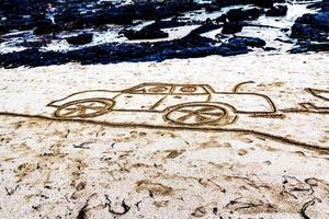 Drawing in the sand. Takapuna Beach, Auckland, New Zealand photo