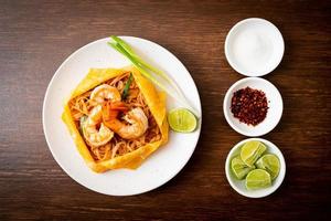 Thai stir fried noodles with shrimps and egg wrap or Pad Thai