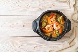 Sour soup made of Tamarind Paste with Shrimps and Vegetable Omelet photo