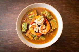 Sour soup made of Tamarind Paste with Shrimps and Vegetable Omelet photo