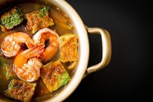 Sour soup made of Tamarind Paste with Shrimps and Vegetable Omelet photo