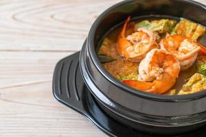 Sour soup made of Tamarind Paste with Shrimps and Vegetable Omelet photo