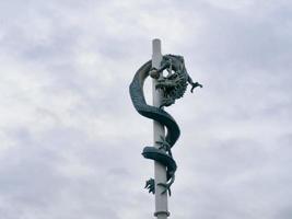 Stone deagon on the pillar. Sokcho city, South Korea photo