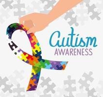 world autism day with ribbon of puzzle pieces vector