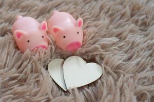 Piggy bank metaphor saving love for lover or family in every day.Concept of happy relationship. photo