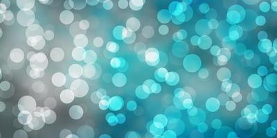 Light BLUE vector background with spots