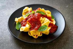 Italian tortellini pasta with tomato sauce photo