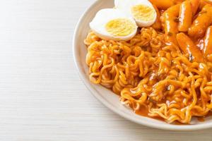 Rabokki or Ramen or Korean instant noodle and Tteokbokki in spicy korean sauce photo