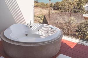 Jacuzzi bath tub on balcony photo