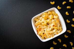 American mac and cheese, macaroni pasta in cheesy sauce photo