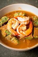 Sour soup made of Tamarind Paste with Shrimps and Vegetable Omelet photo