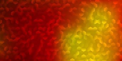 Light red yellow vector background with hexagonal shapes