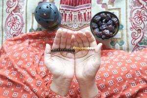 Close up of muslim women hand praying at ramadan photo