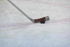 Hockey puck on the ice photo