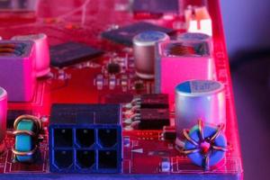 Electronic Printed Circuit Board with Electronic components in red photo