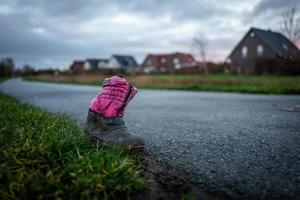 An old children shoe in Wilhelmshaven in Germany photo