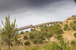 Kilometre-long conveyor belt for transporting stones from the quarry to the plant photo