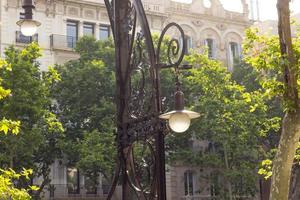 Detail of traditional streetlight located in Gracia Street, Barcelona, Spain. photo