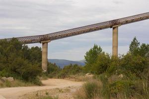 Kilometre-long conveyor belt for transporting stones from the quarry to the plant photo