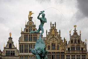 Brabo fountain and traditional flemish architecture at Grote Markt square in Antwerp in Belgium photo