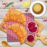 Croissant with a cup of lemon tea on the table vector
